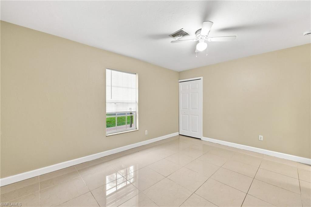 Neutral-toned walls complement the tile flooring in this room