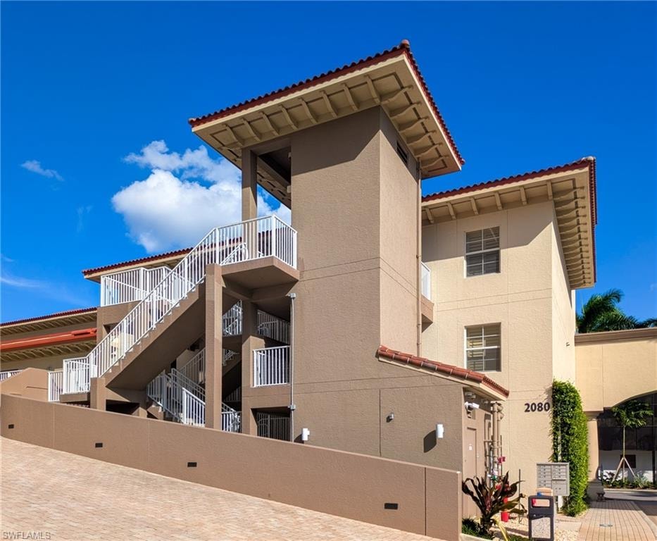 View of apartment building / complex featuring stairs