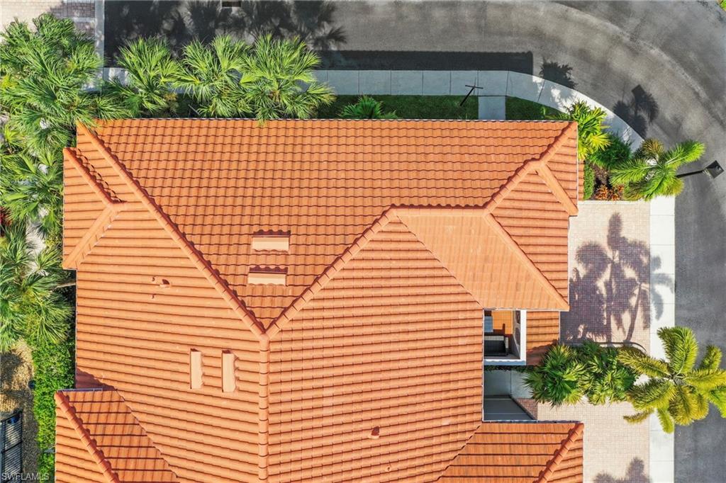 Terracotta tile roofing with multiple gables and visible venting