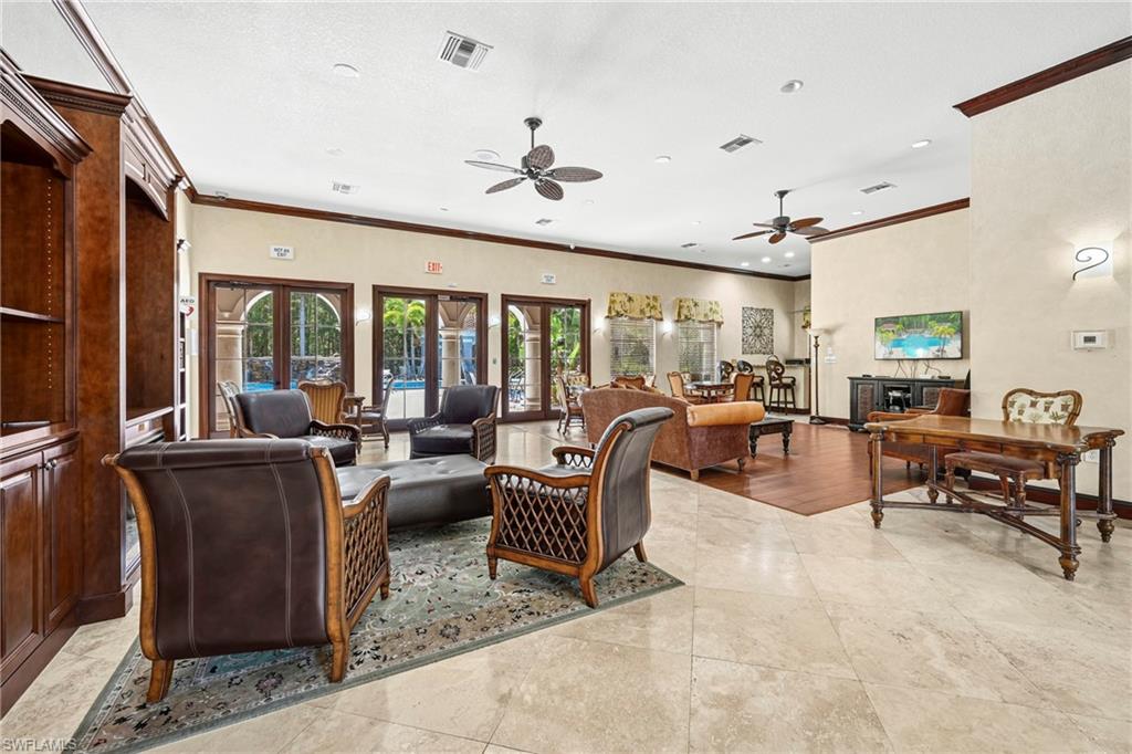 Spacious common area featuring light-toned tile flooring, recessed lighting, and multiple ceiling fans