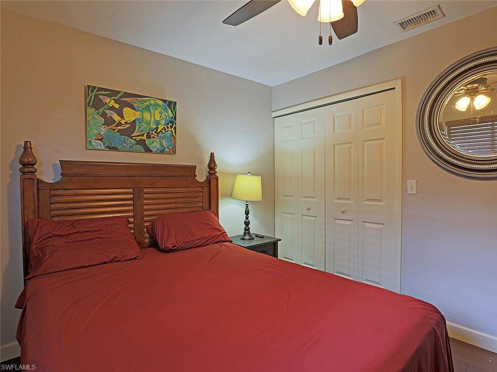 Neutral wall tones complement the wood-finish flooring
