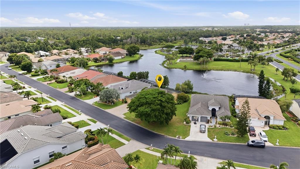 Aerial perspective highlighting a residential property with a direct waterfront setting