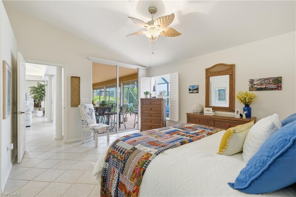 Vaulted ceiling room with white tile flooring