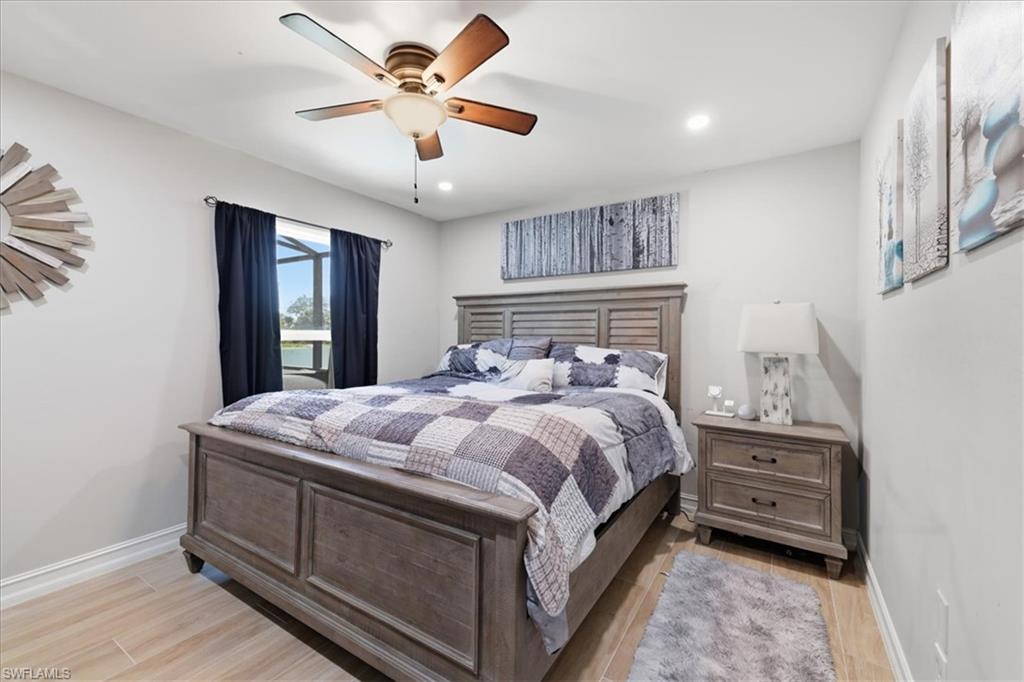 Room with wood-finish flooring and a window offering exterior water views