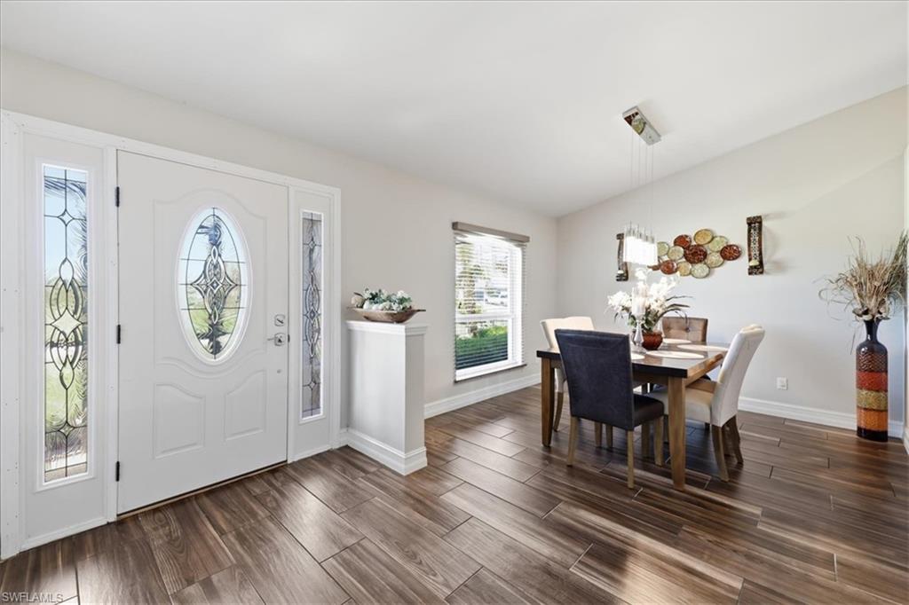 Entryway featuring a decorative frosted glass front door and coordinating sidelights
