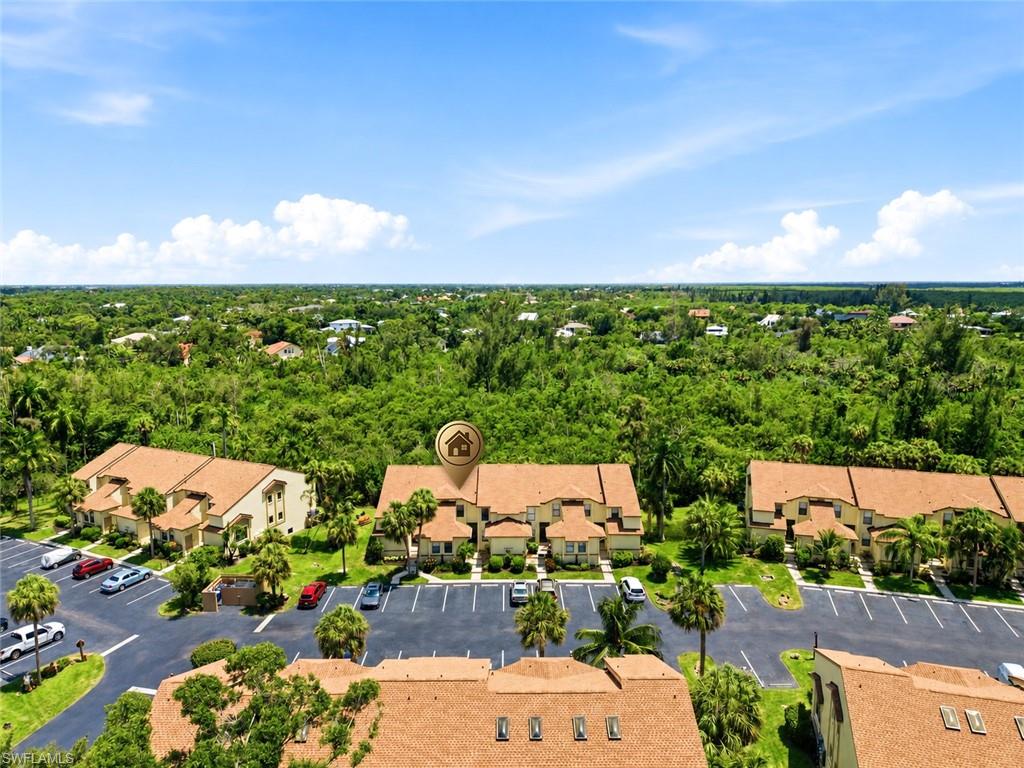 Aerial perspective showcasing multiple two-story residential buildings with terracotta-style roof tiles