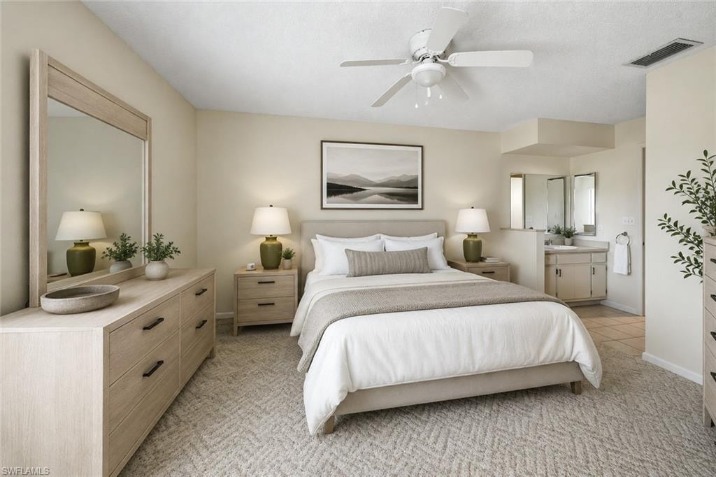 Bedroom featuring neutral wall colors, patterned carpeting, and a ceiling fan