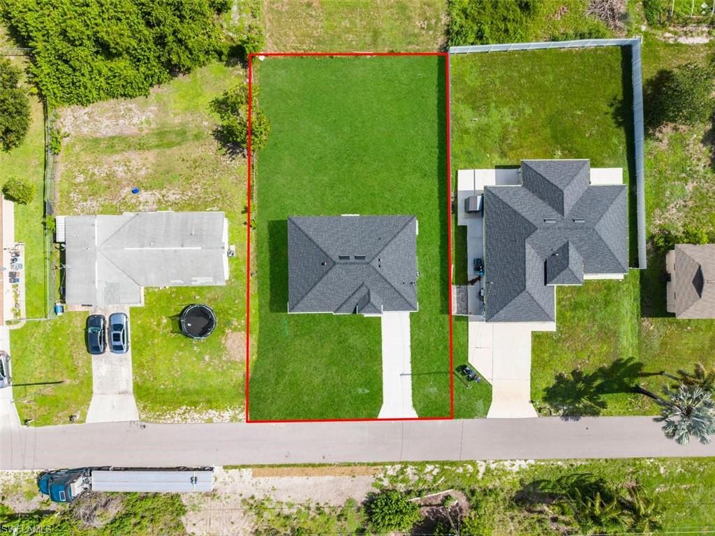 Overhead perspective showcasing a new construction residence on a manicured lot