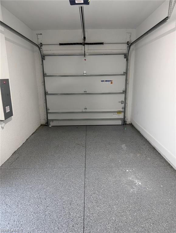 Single-car garage with a gray speckled epoxy floor finish