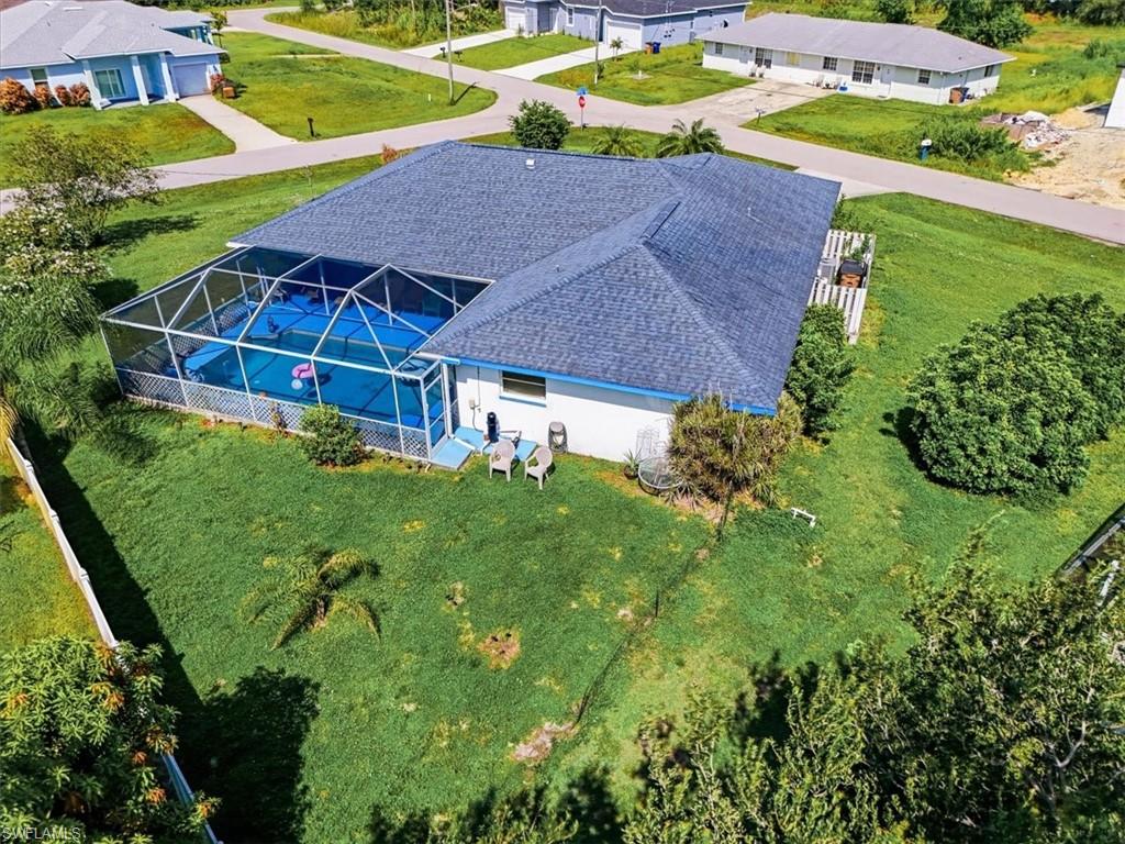 Screened pool enclosure with an in-ground pool