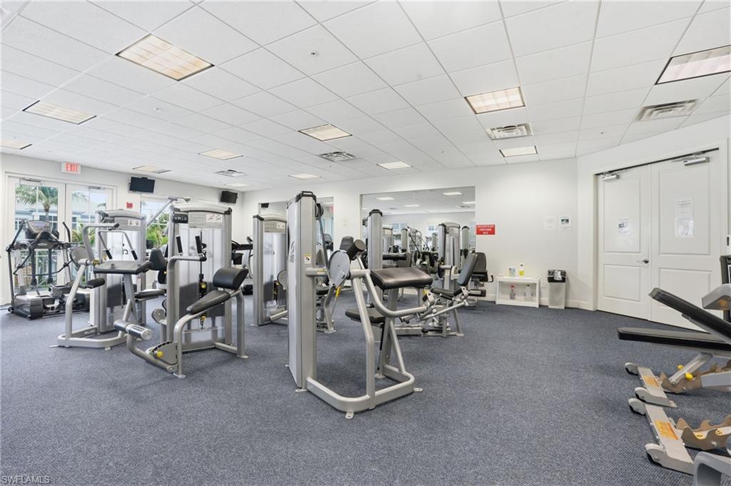 Dedicated fitness center featuring carpeted flooring and recessed lighting