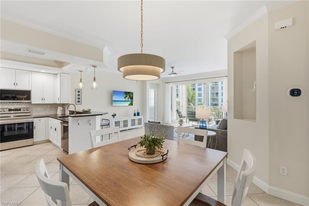 Open-concept living area with tile flooring and a neutral color palette