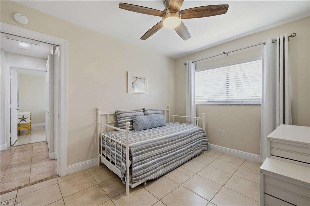 Room with neutral tone walls and large format tile flooring