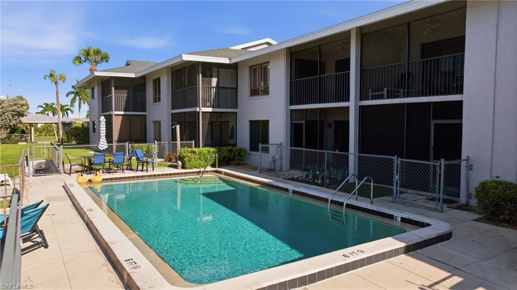 Rectangular swimming pool with integrated steps and a surrounding paved deck