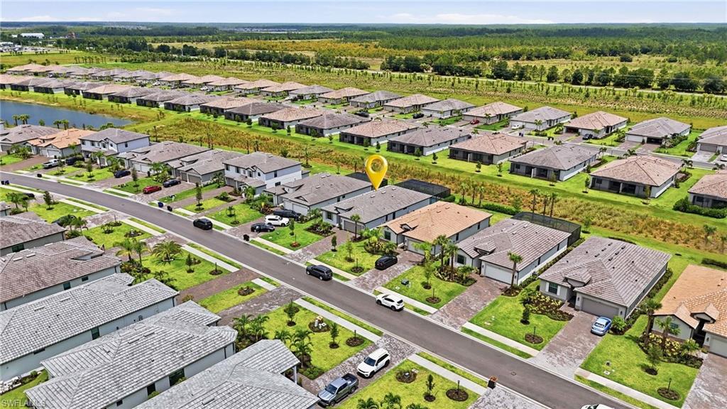 Aerial perspective showcasing a residential community with uniform home designs