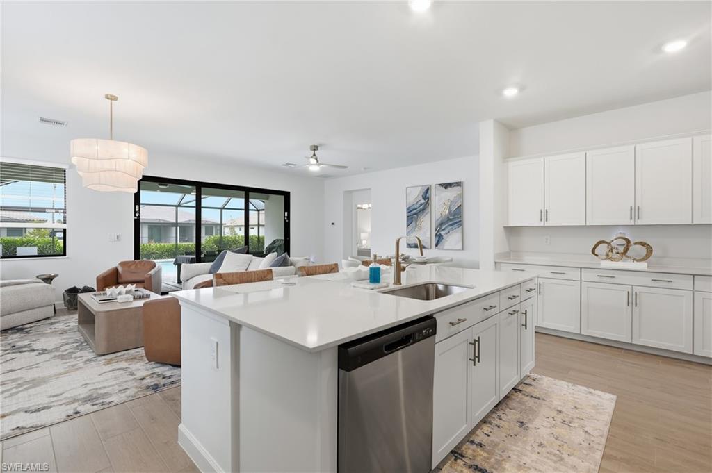 Spacious kitchen island with a built-in sink and stainless steel dishwasher