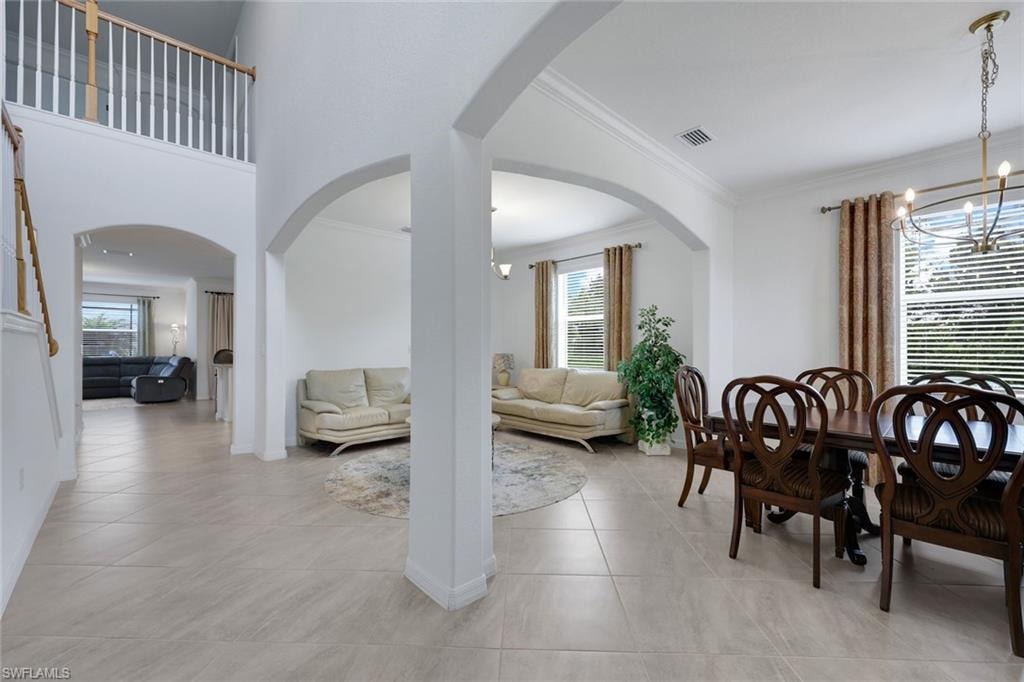 formal dining and sitting areas opens to kitchen and family rooms