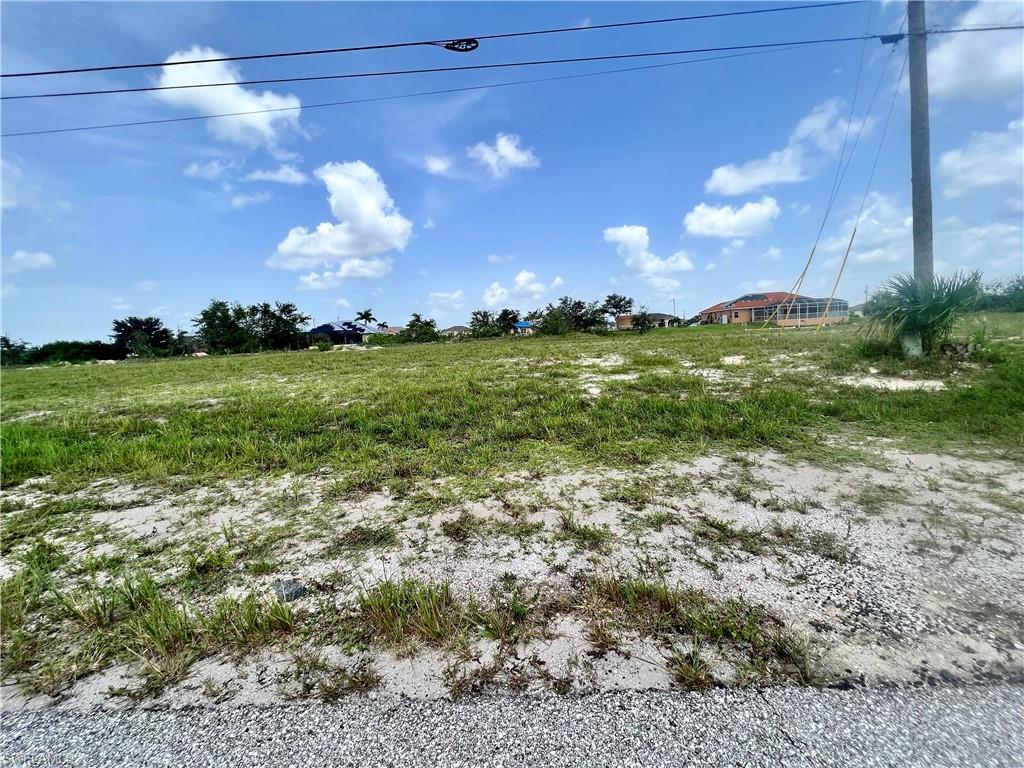 View of yard with a rural view
