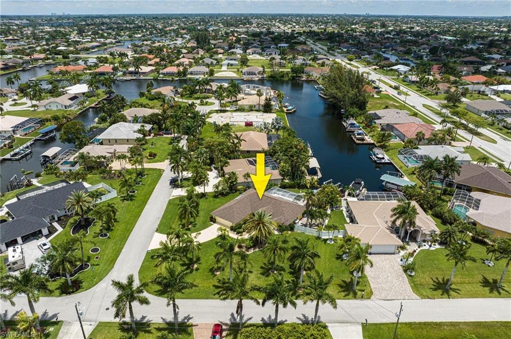 Aerial overview of property's location with nearby suburban area and a large body of water