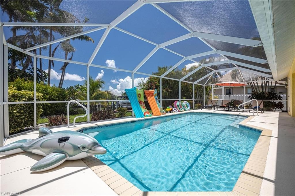 Outdoor pool featuring a patio and a lanai