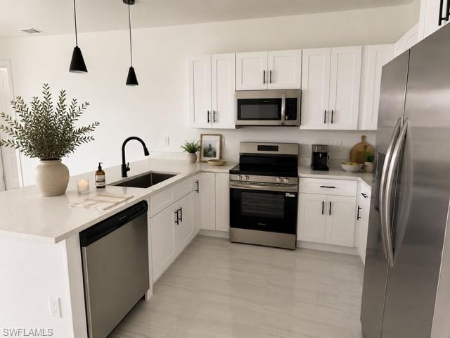 Angle 2- Functional kitchen offering generous prep space and an open layout ideal for entertaining.