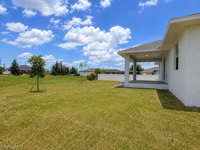 Backyard Angle 2- Large open backyard offering endless possibilities for outdoor living and entertaining.