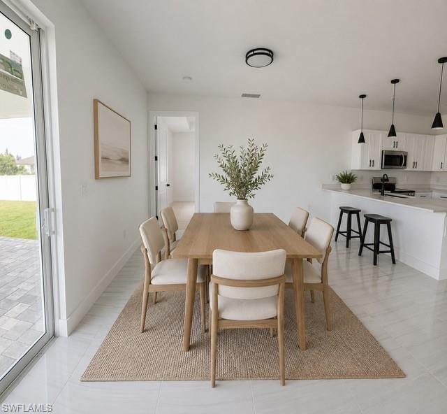 Bright dining area overlooking the backyard with easy access to the kitchen.