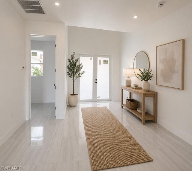 Inviting foyer with abundant natural light and elegant finishes.