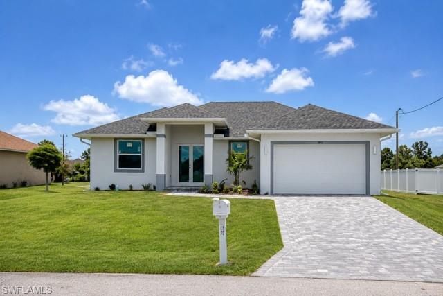 Beautiful curb appeal with a modern exterior, spacious driveway, and attached two-car garage.