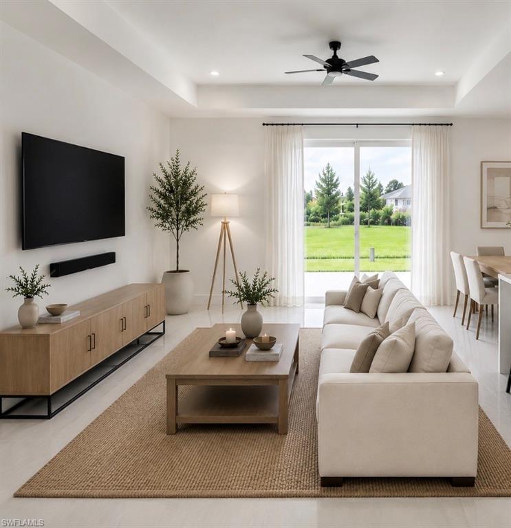 Spacious open living room featuring vaulted ceilings and seamless flow to the kitchen.