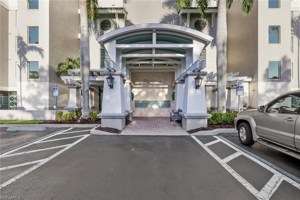 View of exterior entry featuring stucco siding and uncovered parking