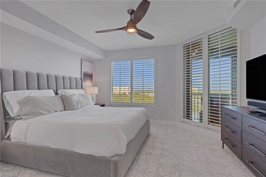 Bedroom featuring a ceiling fan and baseboards