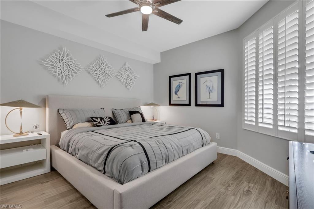 Bedroom with light wood finished floors and ceiling fan