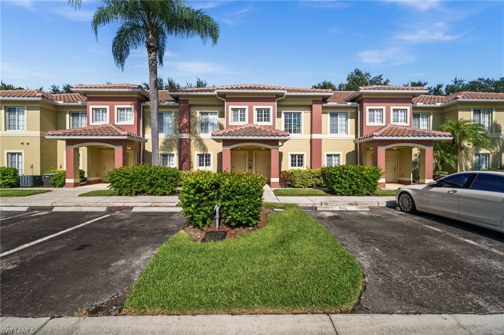 Multi-story residences featuring Mediterranean-inspired architecture with terracotta roof tiles and stucco exteriors