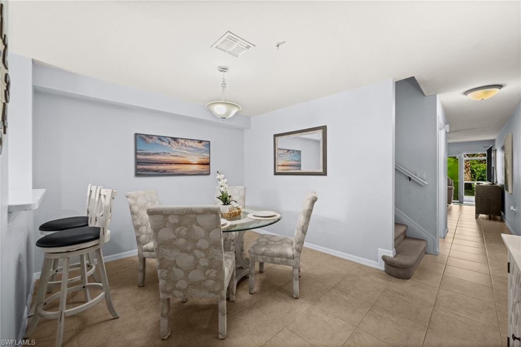 Dining area with tile flooring and neutral wall tones