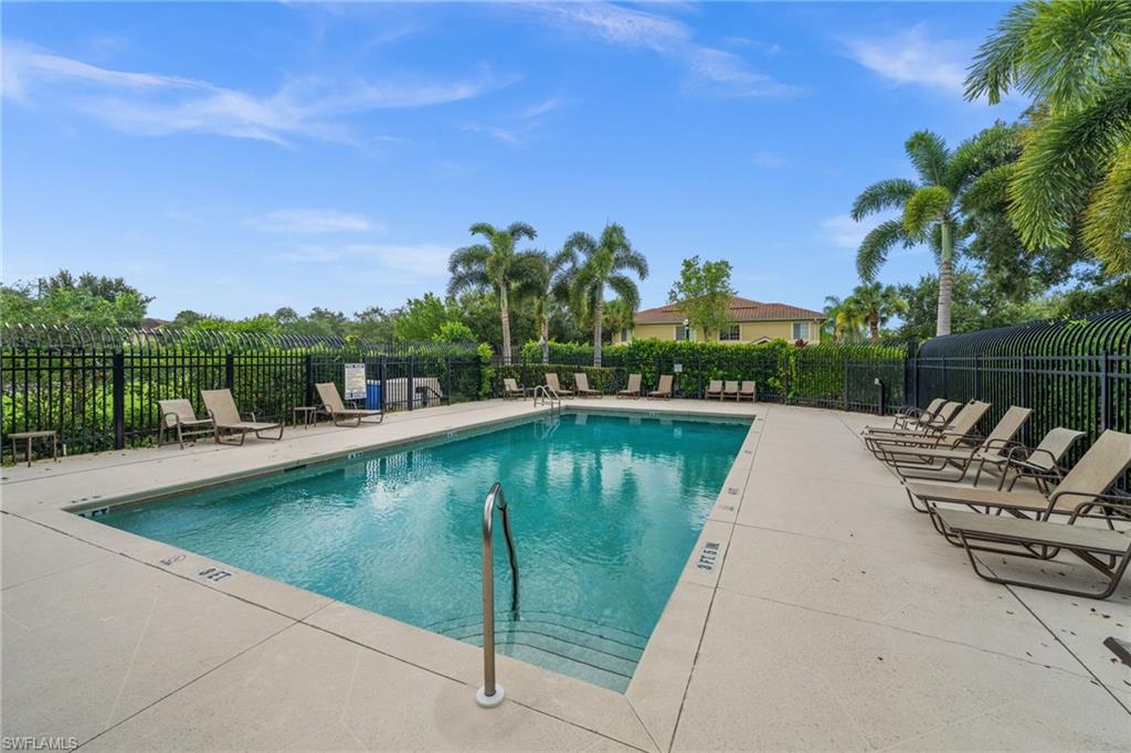 Rectangular in-ground pool with integrated steps, surrounded by a concrete deck