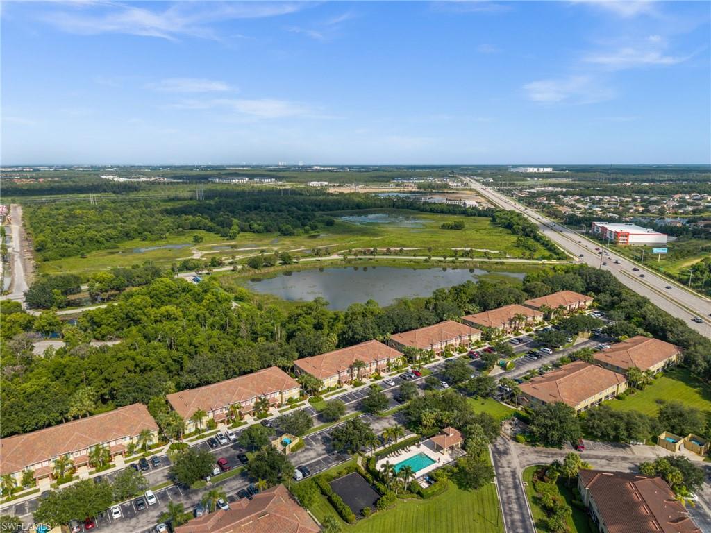 Aerial perspective showcasing multiple residential buildings with terracotta-style roofs
