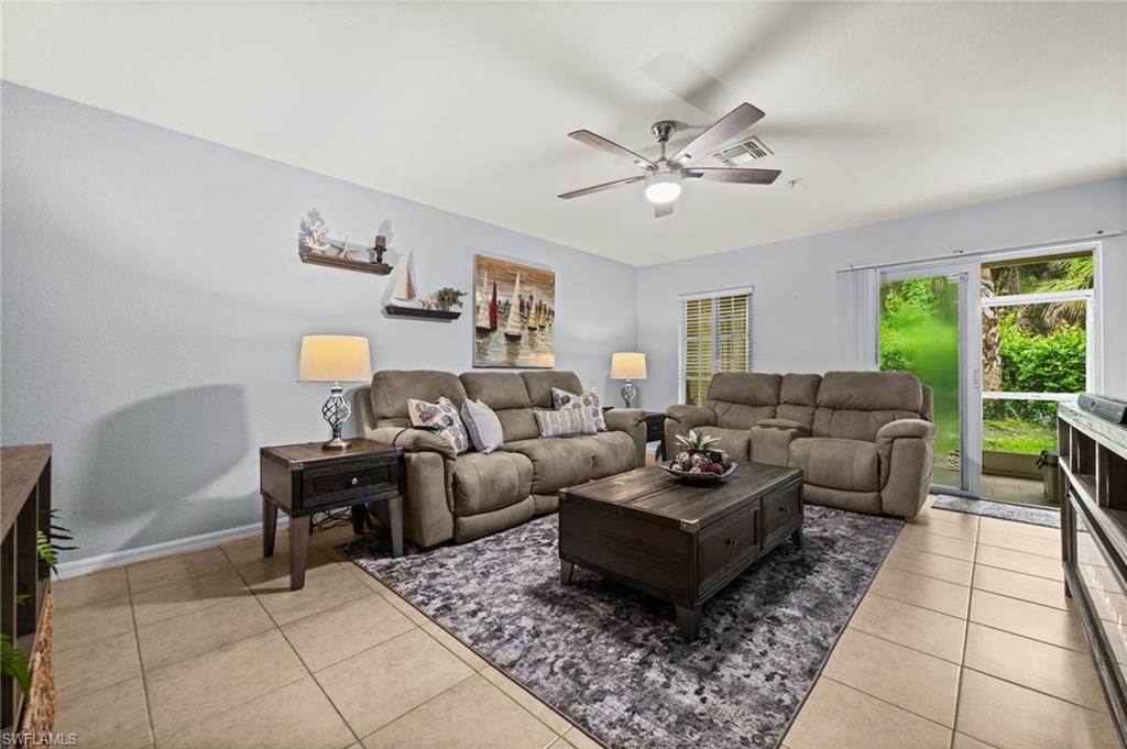 Bright living space featuring tile flooring throughout