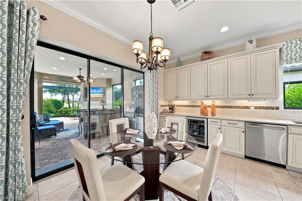 Sliding glass doors opening to an outdoor living area with a paver patio