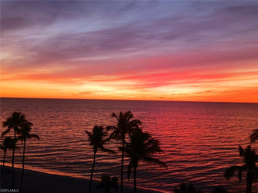 Property view of beach at sunset