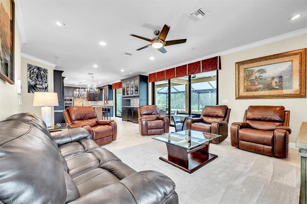 Open concept living area featuring recessed lighting and a ceiling fan