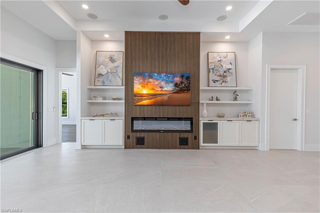 Feature wall with wood-finish slat detailing and built-in electric fireplace