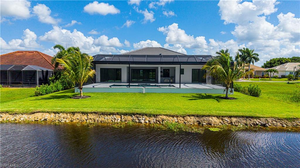 Contemporary residence featuring a screened patio and private pool