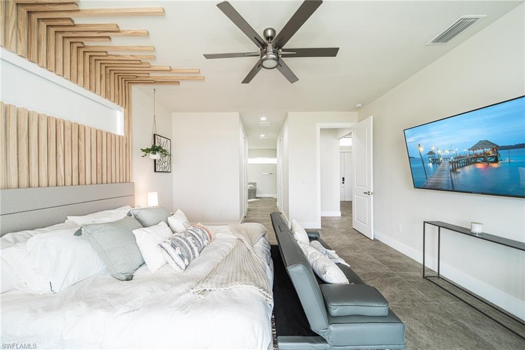 Modern bedroom featuring a striking wood slat accent wall with integrated ambient lighting