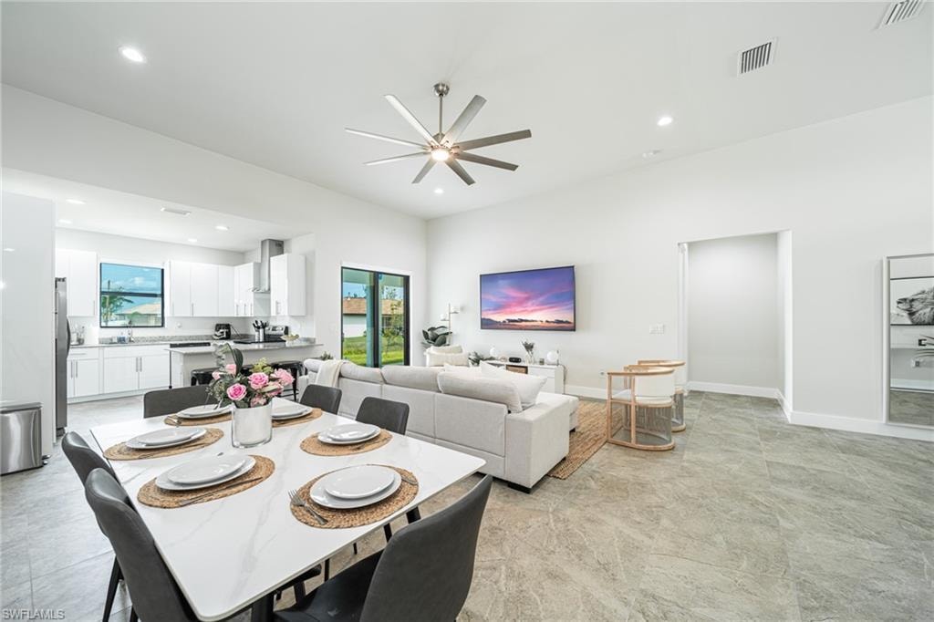 Open-concept interior featuring high ceilings and light-toned walls