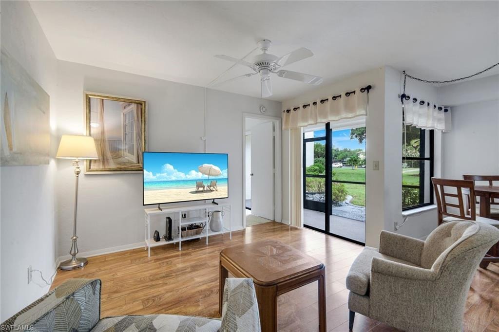 Living room offers golf course and lake views.