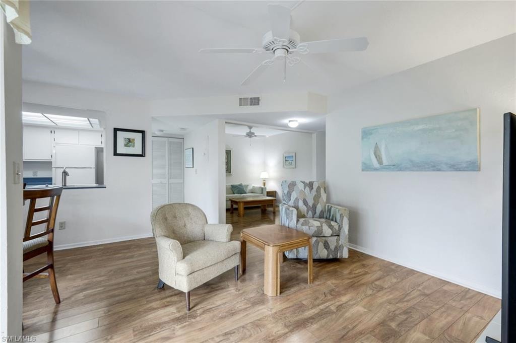 View of living room and den from primary bedroom entry.