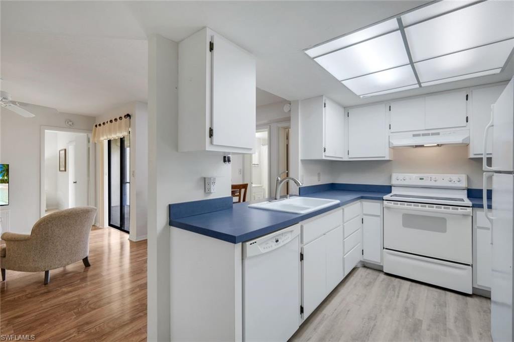 Kitchen, living room and dining room are open to one another.