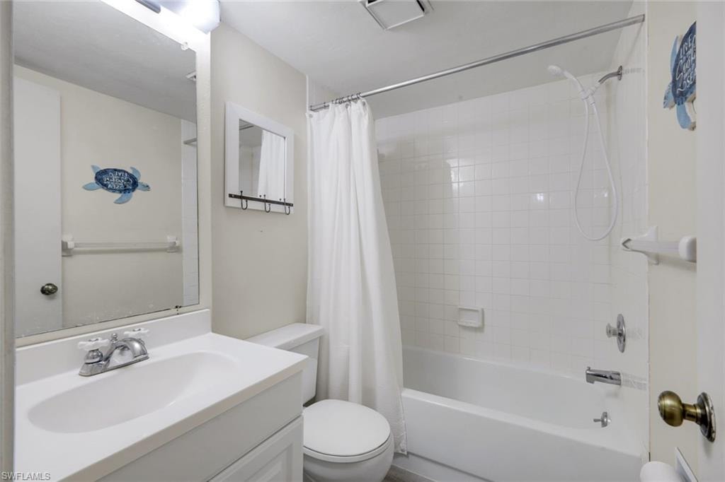 Guest bathroom features a shower/tub.