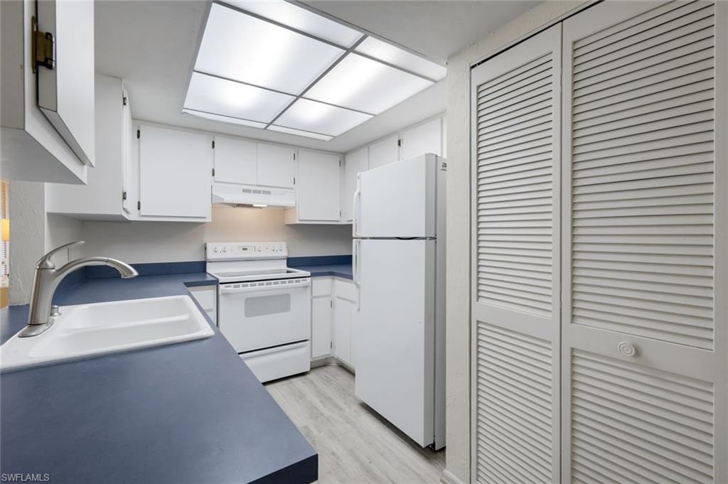 Kitchen features ample counter and cabinet space.